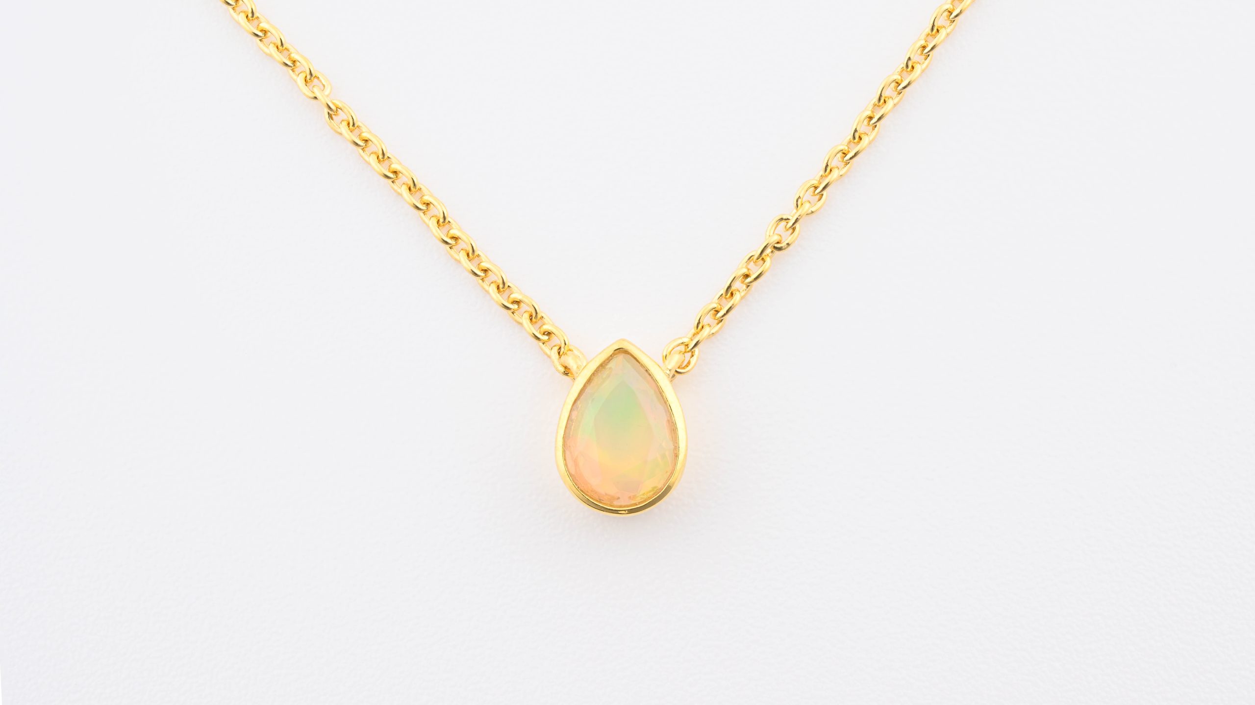 P-WEO-GP-N-WELO-OPAL-PEAR-NECKLACE-18K-GOLD-VERMEIL-PLATED-RAINBOW-ETHIOPIA-FACETED-UP-CLOSE-FRONT-BAREFOOT-NATIVE.jpg Faceted Stone On 18K Gold Vermeil .925 Ss 15" Necklace Welo Opal (Ethiopia) Pear Stone - Image 1